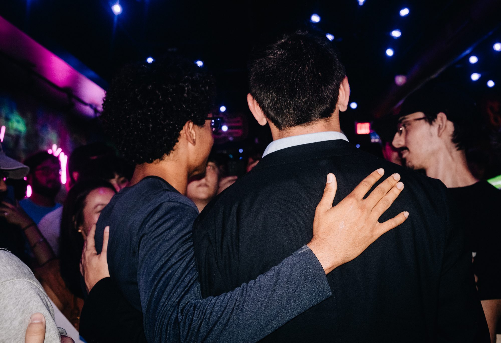 Candidate with a hand on a supporter's back