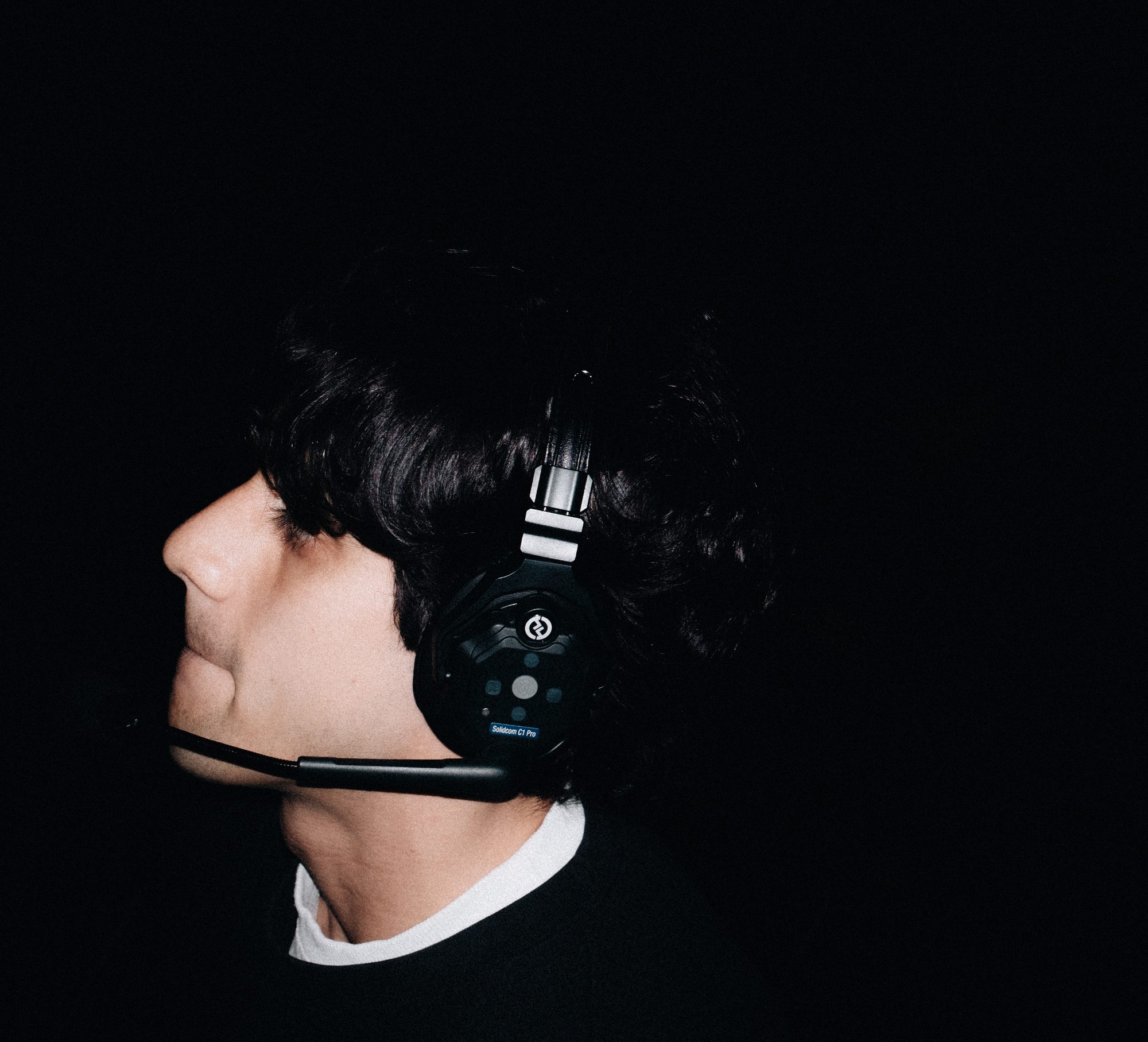 Crew member in a headset, profile