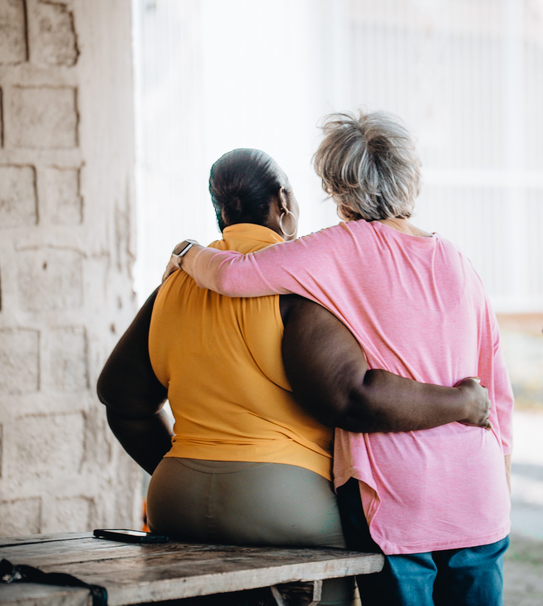 Two women with their arms around each other