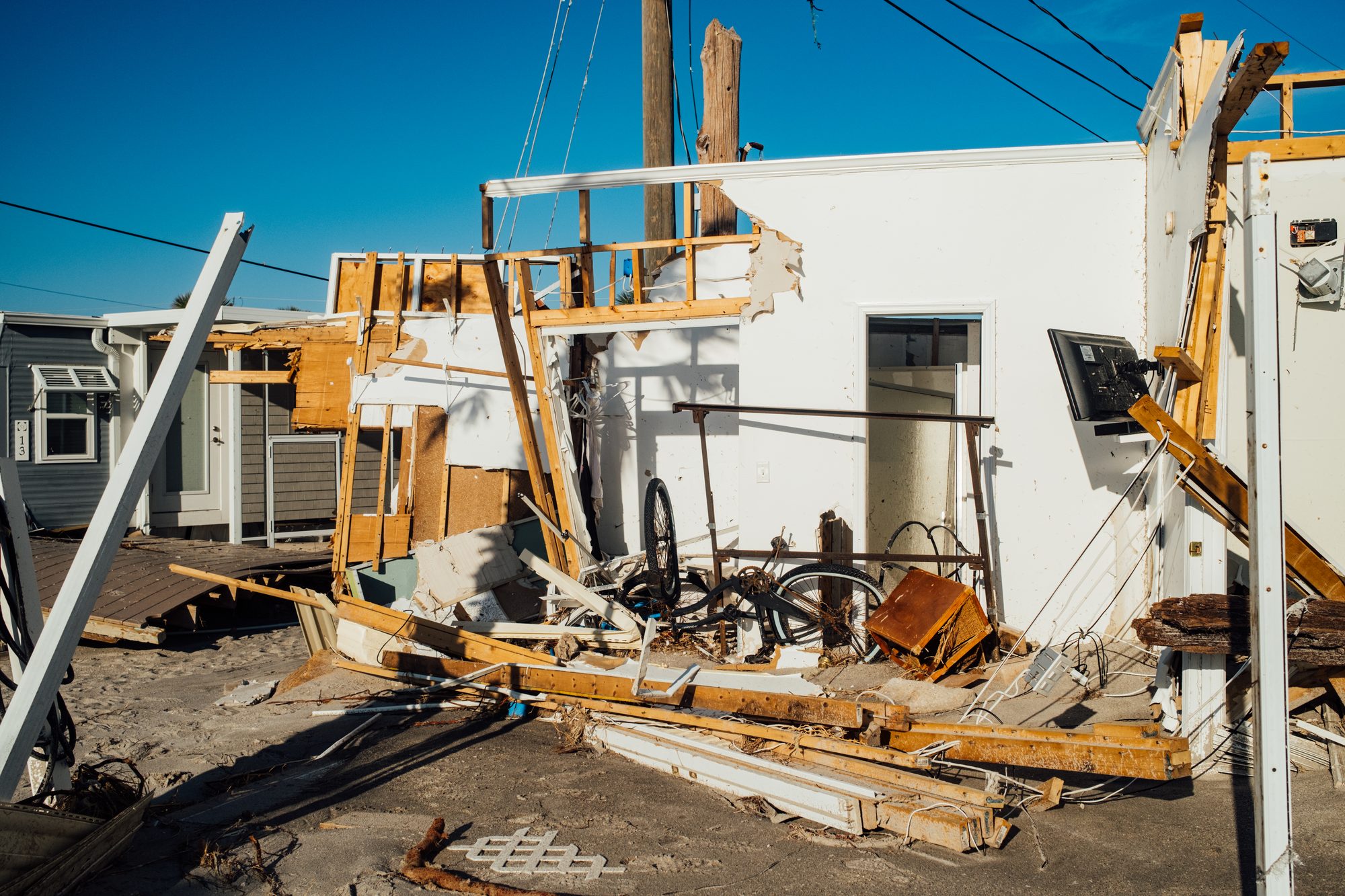 Wreckage of a home stripped to its frame