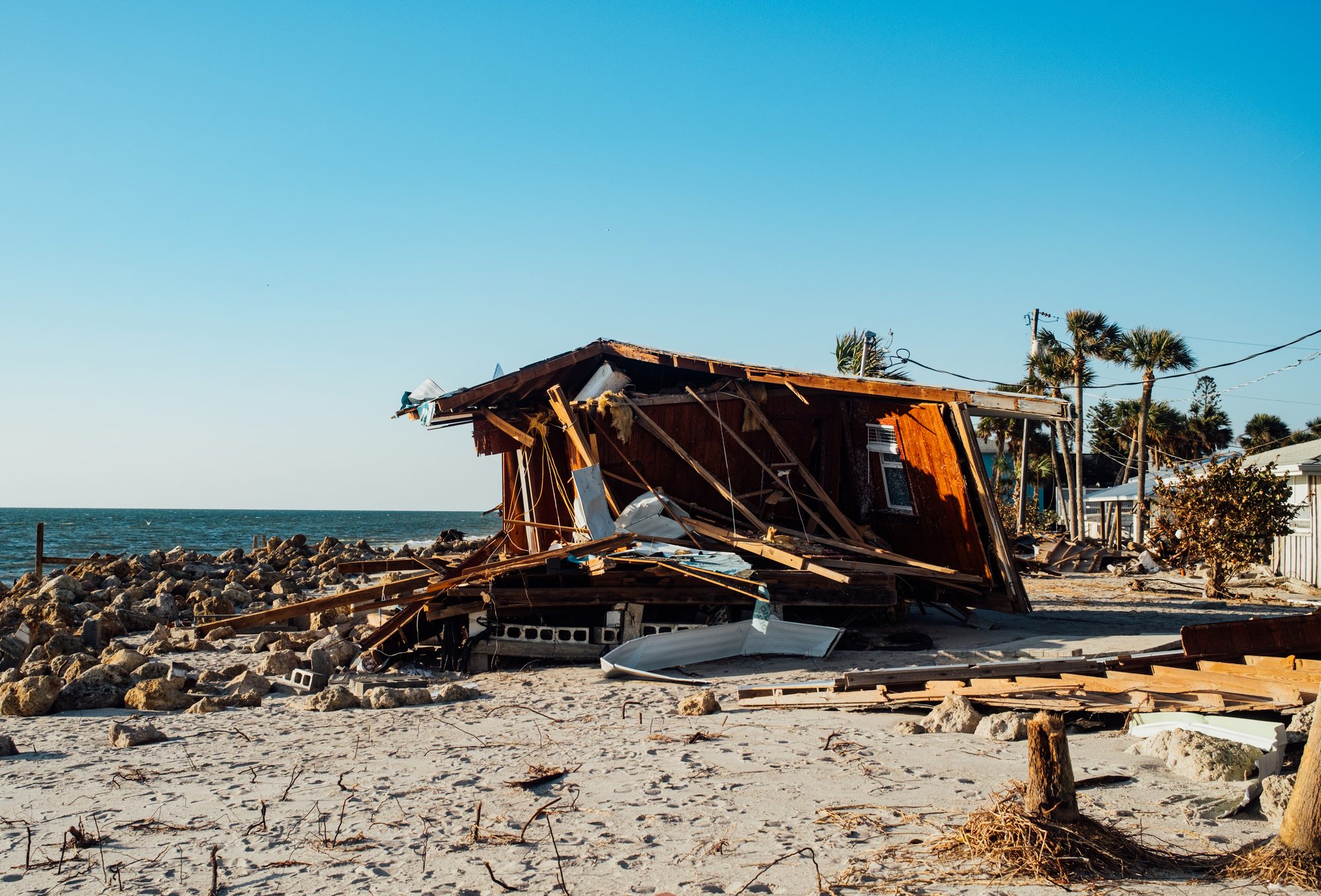 A house reduced to lumber on the shoreline