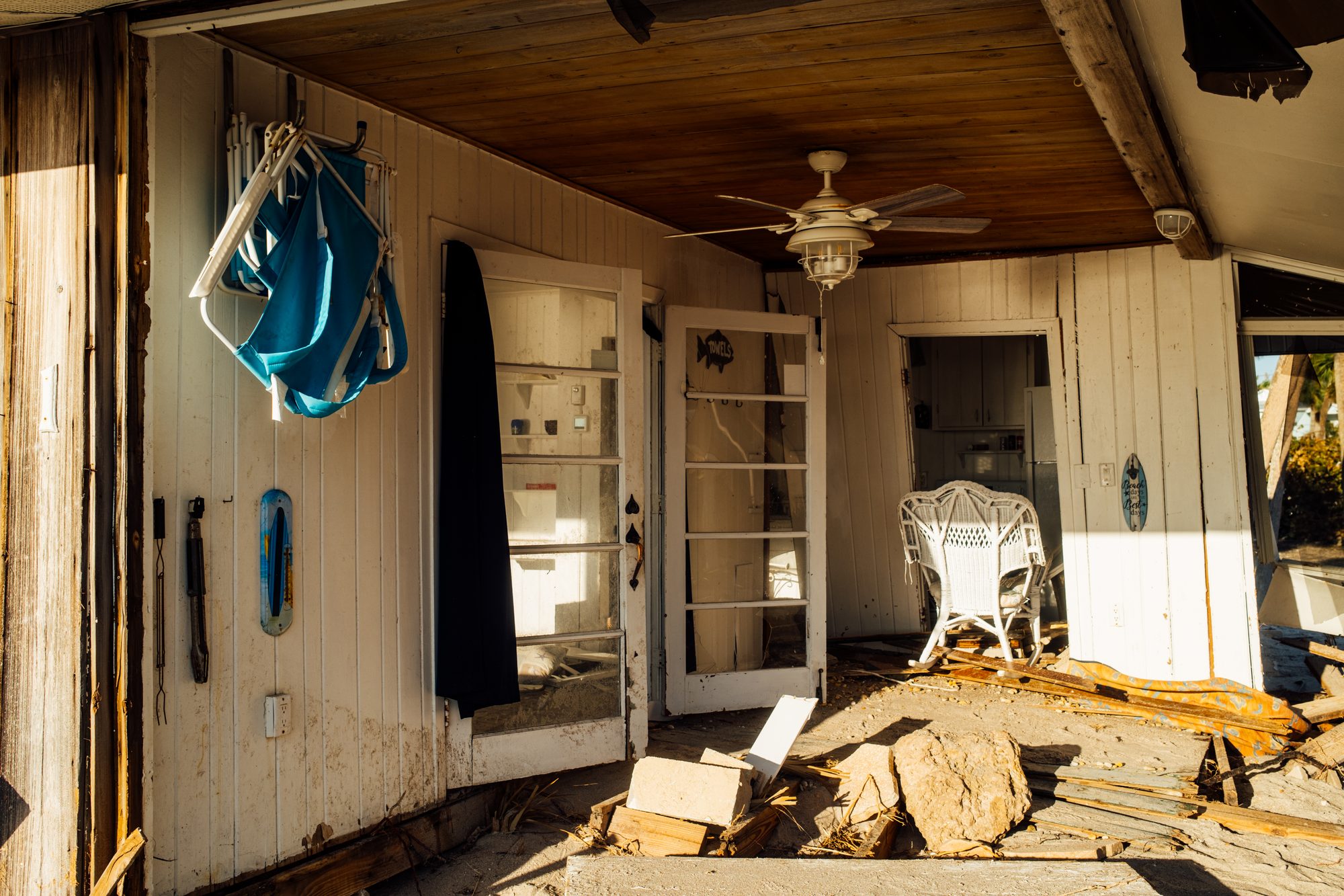 Storm-wrecked room with doors open to the light