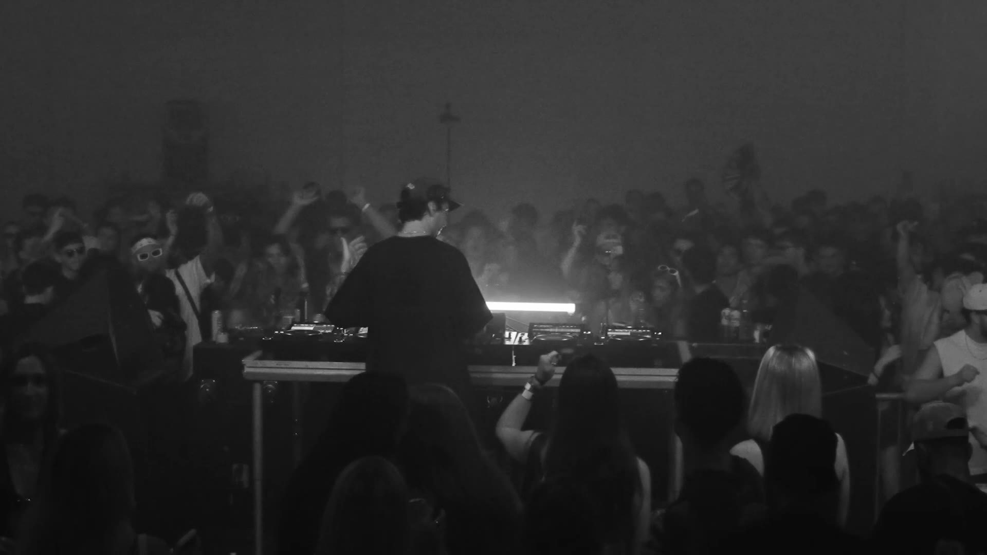 A DJ on stage over the crowd at a Tampa event, filmed by RSO Media Group