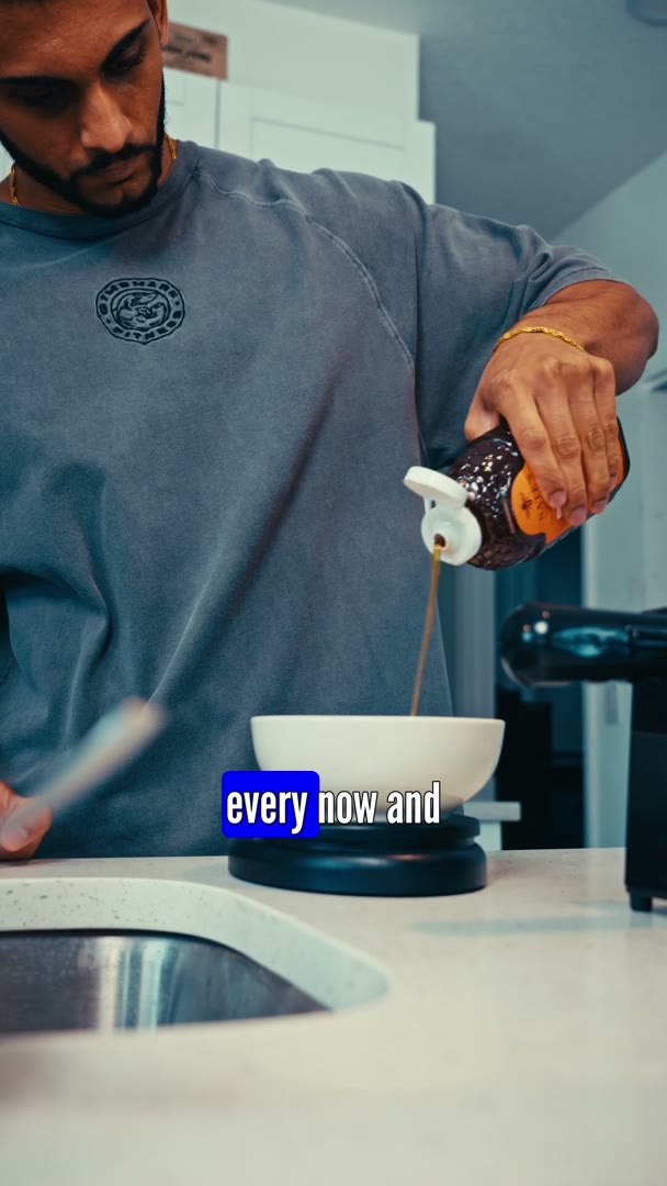Nishaan of Elite Standard Coaching pouring from a bottle into a white bowl on a kitchen scale, with a caption on screen